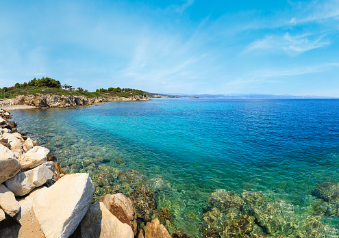 Summer Sithonia coastline and Aegean sea scenery with beach and house (Lagonisi, Halkidiki, Greece). Panorama.