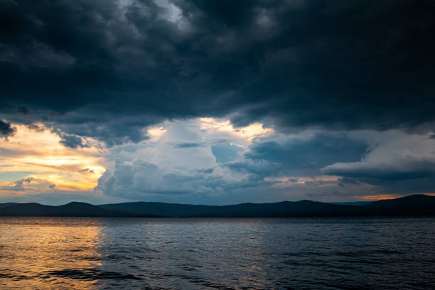 istock Cloudy evening before rain on a picturesque lake 1423639944