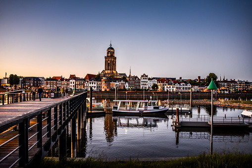 Crowded Bank Of IJessel River And St. Lebuinus Church In Deventer, The Netherlands
