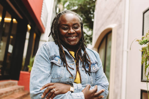 istock Black woman with dreadlocks smiling at the camera 1423641971
