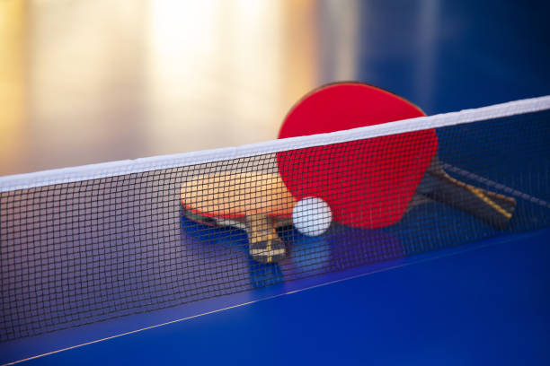 istock blue tennis table with two rackets, white net ball, leisure activities 1423642503