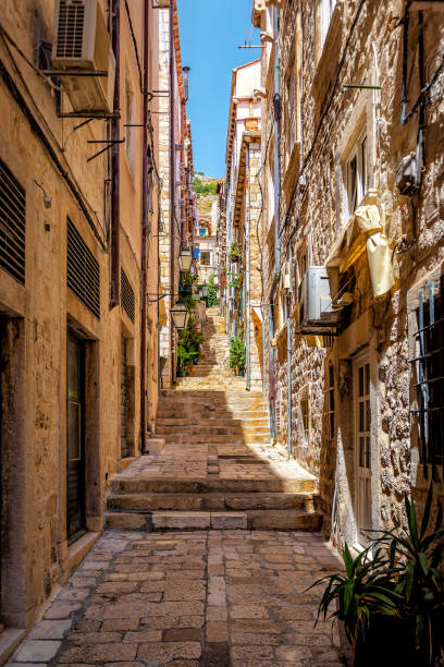 Dubrovnik, Croatia. Dubrovnik old city street view (medieval Ragusa) in Stradum area. Dubrovnik, Croatia. Dubrovnik old city street view (medieval Ragusa) in Stradum area. Vacation and travel theme dubrovnik walls stock pictures, royalty-free photos & images