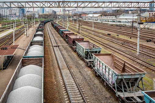 Loaded and empty freight trains. Industrial transportation theme