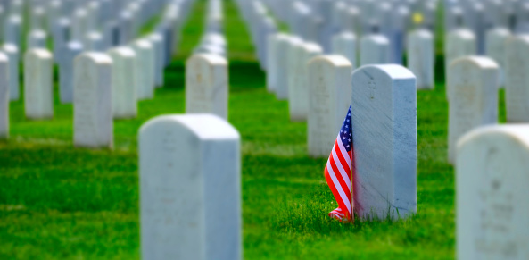 Military cemetery in the United States with headstones for soldiers white marble rows