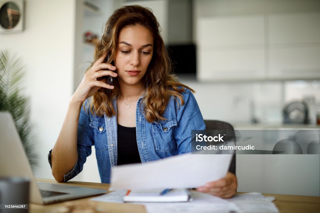 Woman complaining on the phone Using Phone Stock Photo