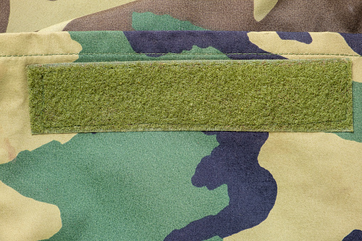 Velcro strip on army woodland camouflage