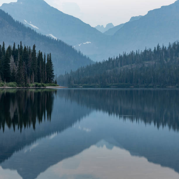 istock Converging Ridges with Glacier Mountains Over Lake 1423648551