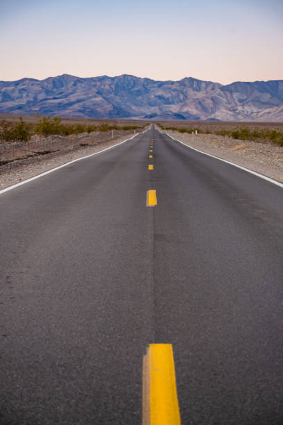 istock Looking Down A Straight Road Toward The Panamint Range 1423650281
