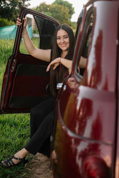 istock Relaxed girl on a car 1423651196