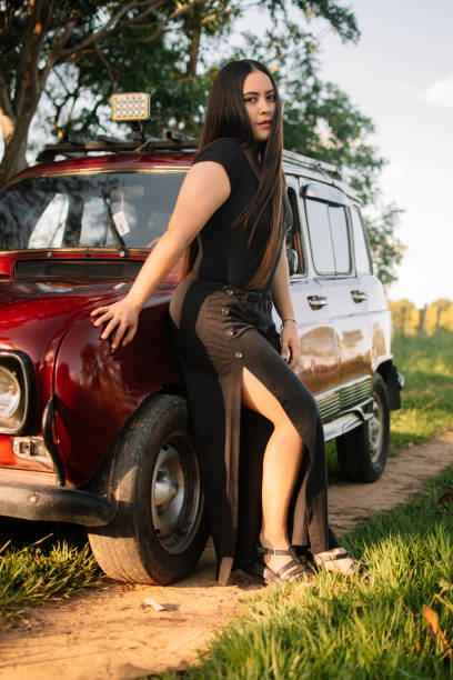 istock Relaxed girl on a car 1423651302