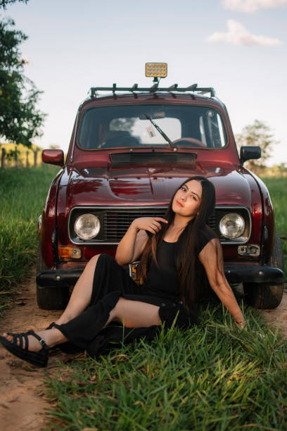 istock Relaxed girl on a car 1423651307