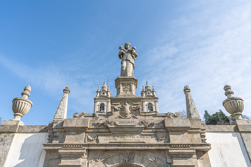 Braga, Portugal - Feb 6, 2020: Fountain of Charity at Three Virtues Stairway at Sanctuary of Bom Jesus do Monte (created by Antonio Jose Pereira in 1837) - Braga, Portugal