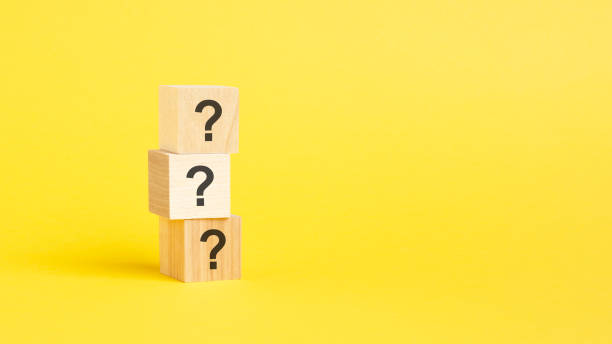 istock question mark shown on three wooden cubes on a yellow background 1423658518