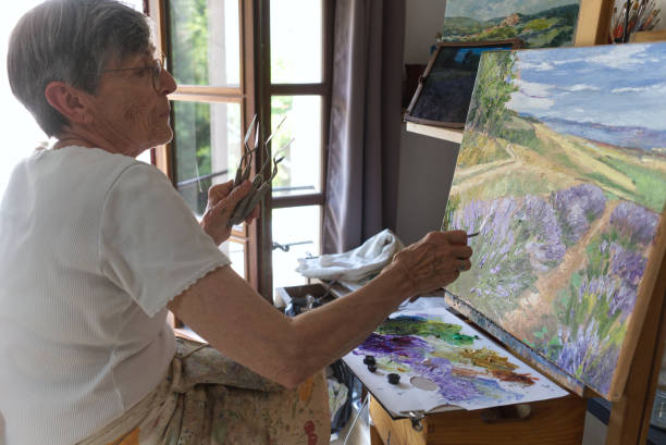 istock Senior artist painting 1423658970