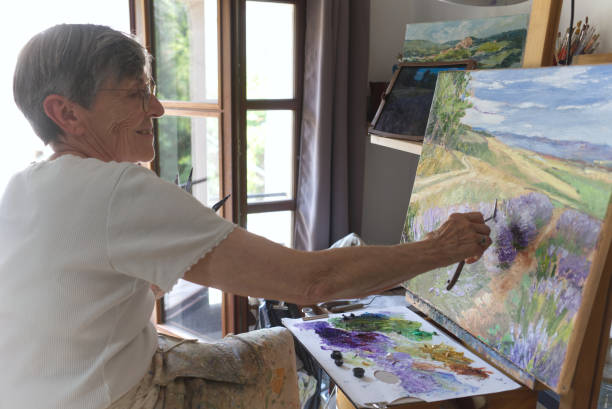 istock Senior artist painting 1423658973