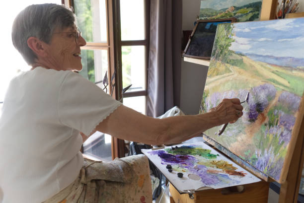 istock Senior artist painting 1423658975