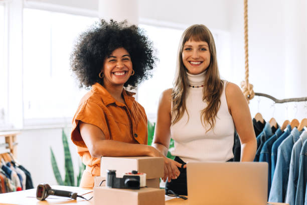istock Successful online store owners smiling at the camera happily 1423659261