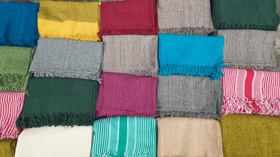 Jeddah, Mecca Region, Saudi Arabia: colourful patterns of Middle-Eastern textiles for sale at Suq Al Alawi