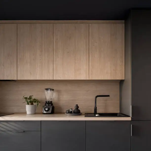 Photo of Small dark and wooden kitchen, close-up