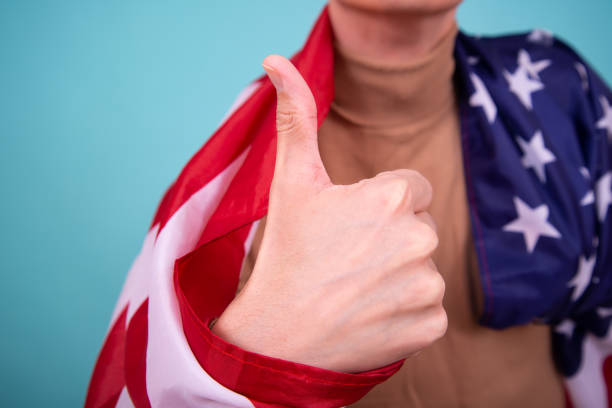 istock Young attractive guy with a flag posing in the studio. 1423663289