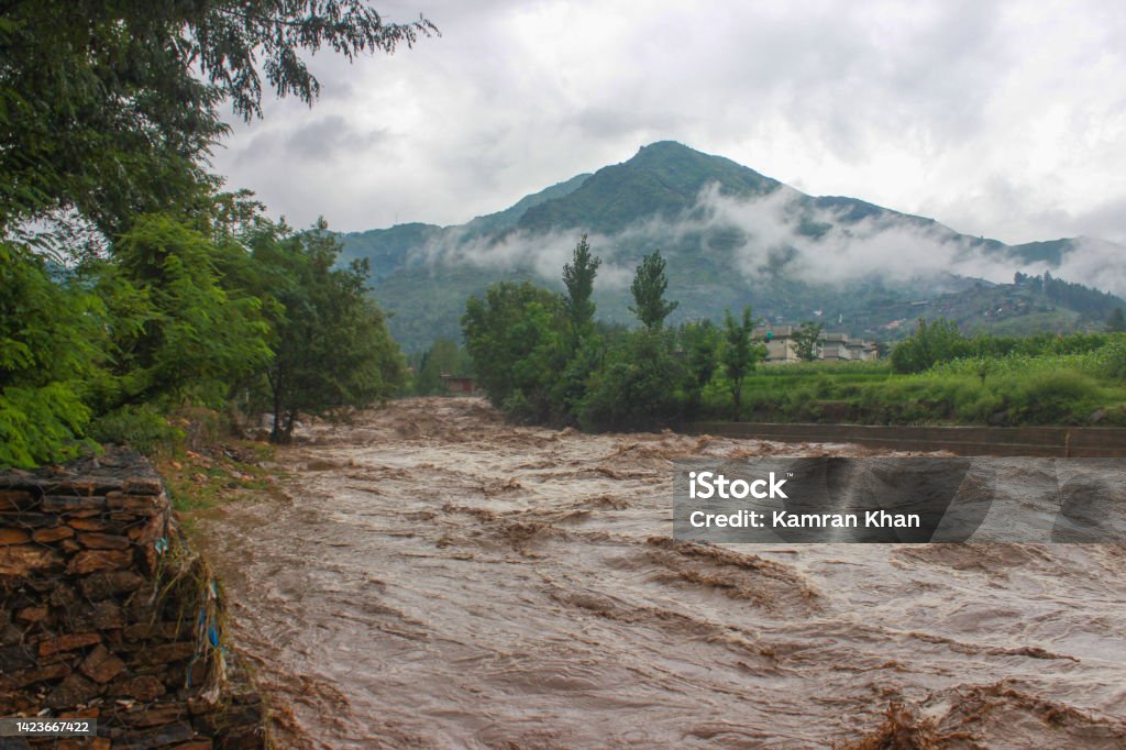 Heavy Flood 2022 Heavy Flood after Heavy Rain In the Local Stream. Flood Water Entered very Fast to the Houses and Shops . Houses to Near The Bank and Things which are commonly Use are Destroyed Badly. This Picture is of the 1st  day of Flood and the water Level is Decreased This Time. Date 24th Of August 2022. Mingora Swat Pakistan. Flood Stock Photo