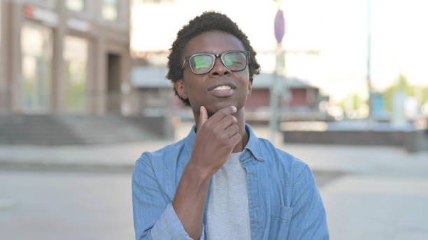 istock Pensive Young African Man Thinking Outdoor 1423670281