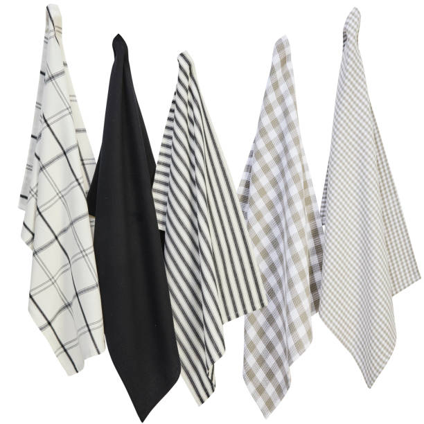 istock Several tablecloths and hand towels were hung on the wall isolated on white background with clipping path 1423675083