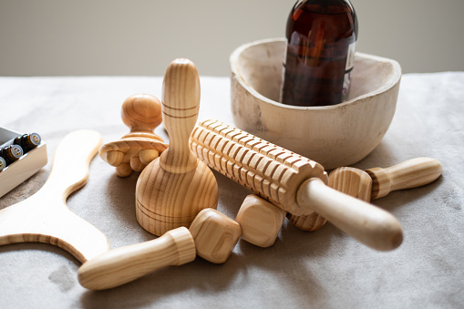 Wood therapy instruments on massage table