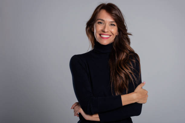 Confident and beautiful long haired woman studio portrait