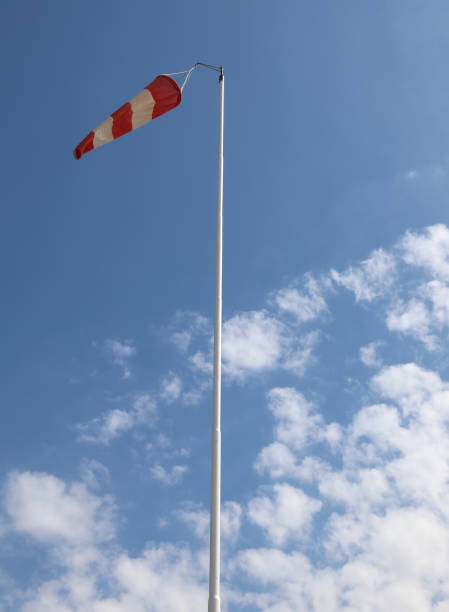 istock red and white windsock to indicate the direction 1423677987