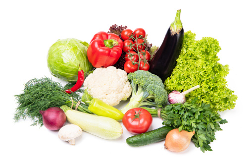 many fresh and ripe vegetables isolated on white.