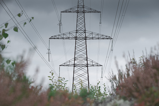 Electric Power Lines and Transmission Tower seen from below