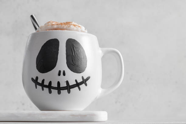 istock Mug with scary Jack's face. Halloween background. Halloween party. 1423687756