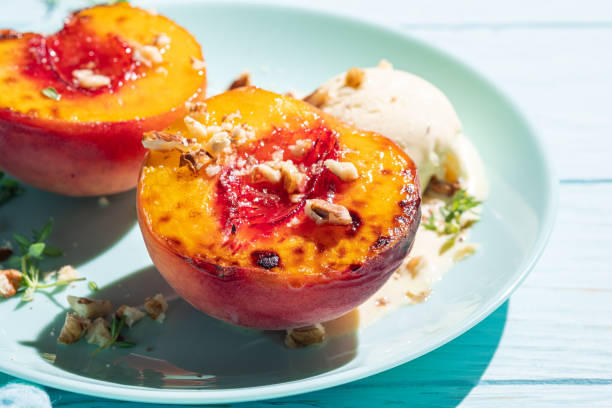 istock Grilled peaches with vanilla ice cream and honey. 1423687890