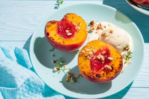 istock Grilled peaches with vanilla ice cream and honey. 1423687895