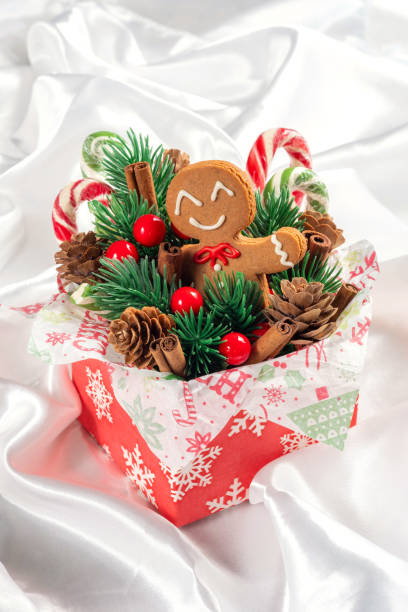 Christmas Decorations with Gingerbread man cookie and Gift Box.
