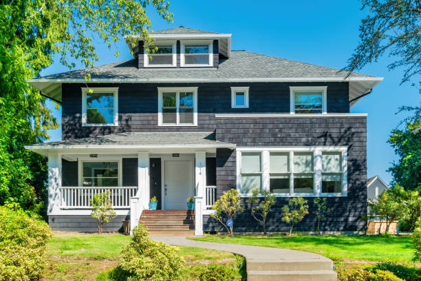 Detached house with shingle walls in Denny Blaine district, Seattle, Washington USA on a sunny day.