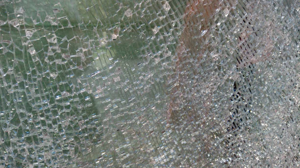 istock Strained glass broken window from explosion splinter. Shattered glass. Abstract blurred defocused broken glass texture background. Abstract background. Blurred image 1423695189
