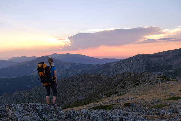 istock A Female backpacker admiring mountains at sunset 1423706000