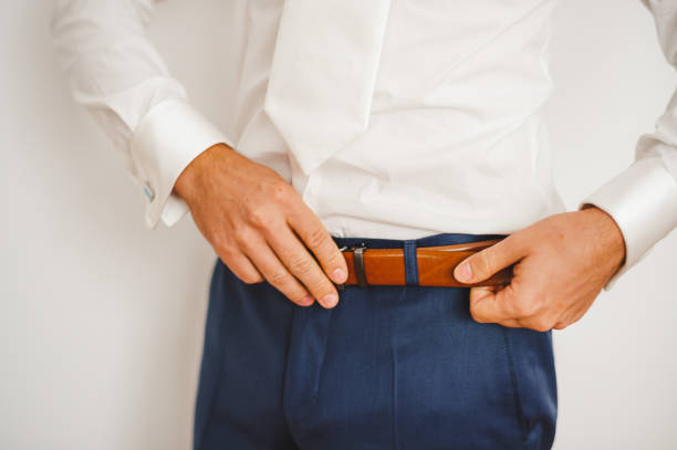 istock Groom with his belt 1423709957