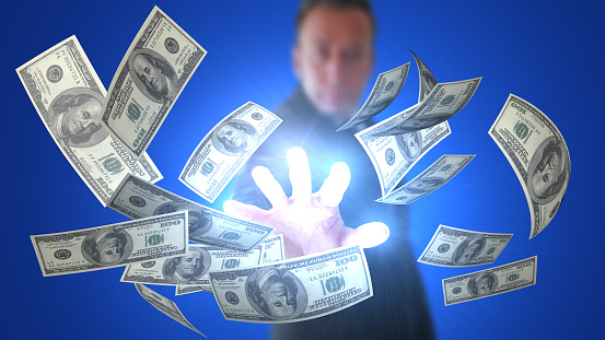 Angel investor who spreads money with a magic hand. Genius broker who attracts money with a magic hand gets rich quick. / You can see the animation movie of this image from my iStock video portfolio. Video number: 1423538659