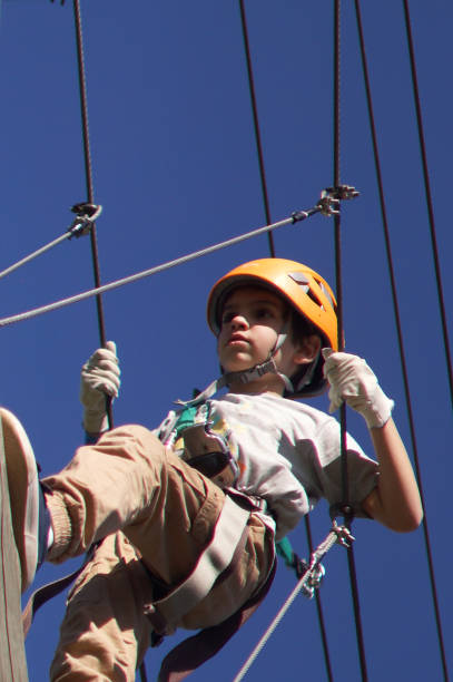 istock kids doing adventure crossing over bridges 1423713339