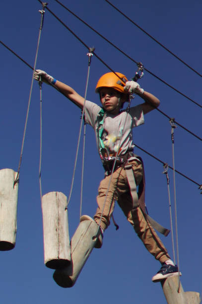 istock kids doing adventure crossing over bridges 1423713400