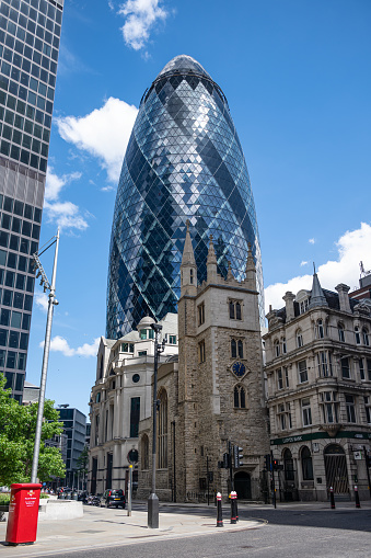 The glass skyscraper building known as The Gherkin at 30 St Mary Axe in the financial district of London