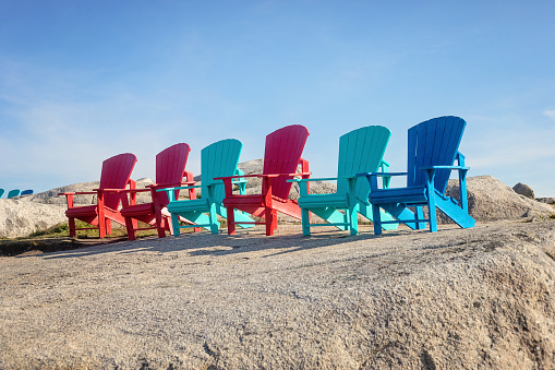 Beach chairs on white sand coast