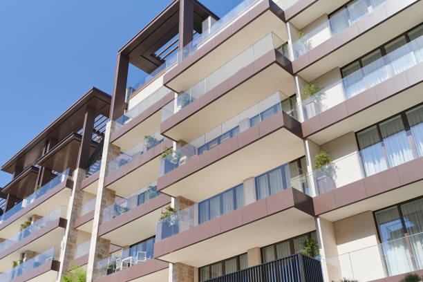 istock Modern apartment building with glass railing balcony 1423717315