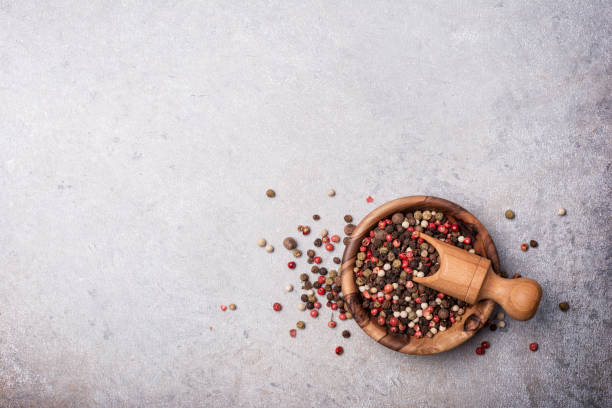 istock Mix peppercorns in wooden bowl 1423719916