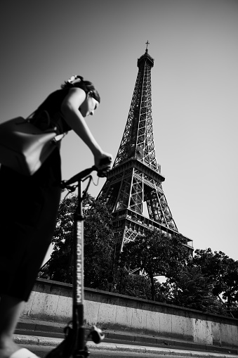 Paris Eiffel tower with women on scooter