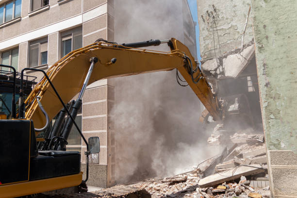 istock Excavator breaking house. Old building demolishing 1423724397