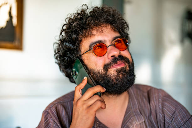 istock Portrait of a man talking on mobile phone 1423732029